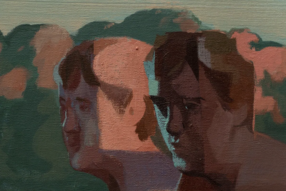 Detail of the two doubled faces against the pink treeline