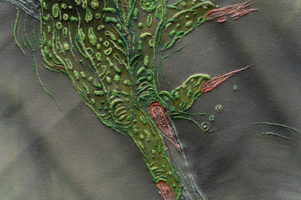 Macro detail of raised thread against the chalk-pastel ground