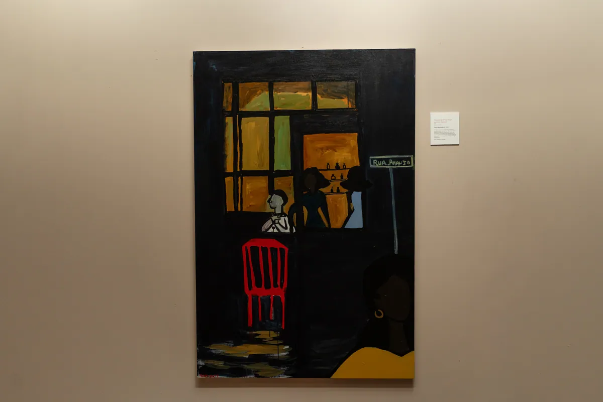The painting hanging on a pale wall at TolHouse with its wall label